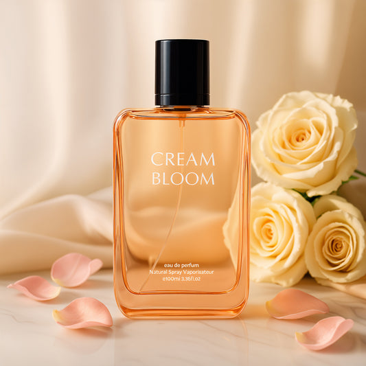 Perfume bottle labeled 'Cream Bloom' with white roses and petals on a soft background